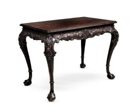 AN IRISH GEORGE II CARVED MAHOGANY CENTRE TABLE 19TH CENTURYWith solid figured mahogany book matched top 76cm high, 107cm wid