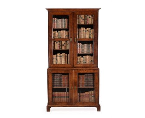 A GEORGE I WALNUT AND FEATHER-BANDED BOOKCASEOF SMALL PROPORTIONS, CIRCA 1720The doors opening to adjustable shelves211cm hig