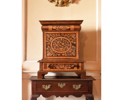 A WALNUT AND MARQUETRY TABLE TOP CABINETIN WILLIAM AND MARY STYLE, INCORPORATING SOME PERIOD ELEMENTSThe top with a concealed