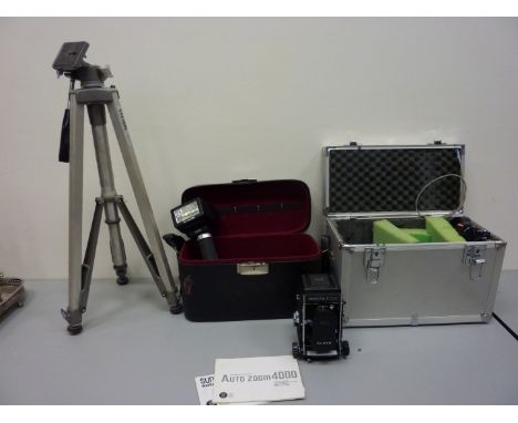 Mamiya C330 Professional camera with interchangeable lenses in hard case, Auto Zoom 4000 SCR computer flash unit and a Velbon