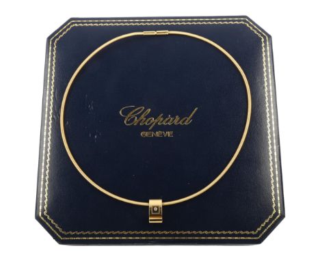 CHOPARD - an 18ct gold Happy Diamonds pendant necklace, with 0.05ct modern round brilliant-cut floating diamond within curved