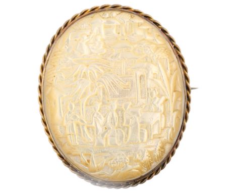 A Chinese mother-of-pearl cameo brooch, relief carved depicting figures in courtyard, in unmarked yellow metal frame, brooch 