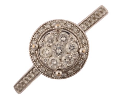 A modern 18ct white gold diamond halo cluster ring, pave set with modern round brilliant-cut diamonds, total diamond content 