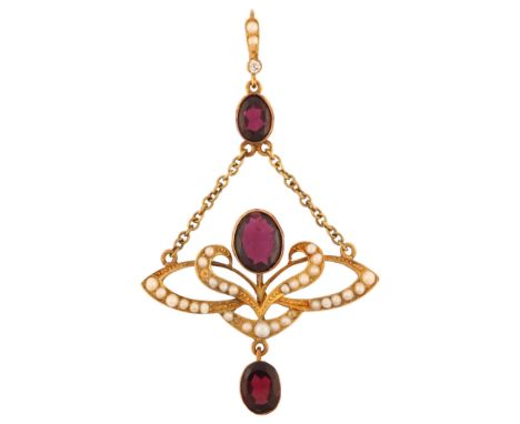 An Edwardian 15ct gold garnet pearl and diamond openwork drop pendant, with central floral motif set with oval flat-top garne