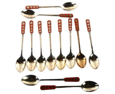 EGON LAURIDSEN - a set of 12 Danish vermeil sterling silver and red enamel coffee spoons, with shamrock and clover design, le
