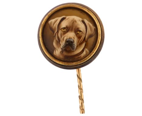 A Victorian hand painted enamelled dog stickpin, unmarked yellow metal settings with circular enamel panel depicting head of 