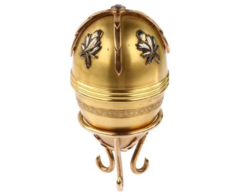An Elizabeth II 9ct gold moonstone St James House commemorative Easter egg, hallmarks London 1982, on triform base, overall h