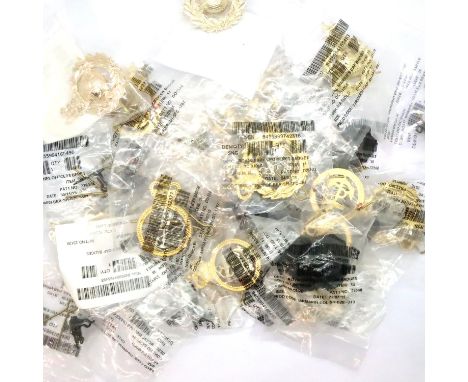 A quantity of unissued Royal Marines and Royal Navy cap badges and collar titles. P&amp;P Group 1 (£14+VAT for the first lot 