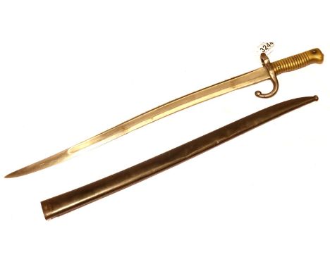 A French Sabre Bayonet model 1859 with curved blade,  brass hilt and metal scabbard, both numbered 12113, the blade dated 187