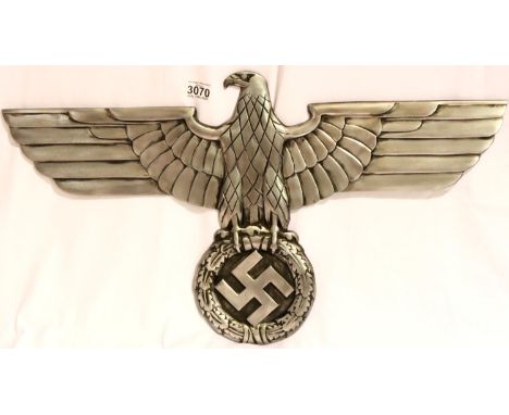 An NSDAP Railway eagle, large reproduction in cast metal, having threaded holes for mounting verso, wingspan 70 cm. P&amp;P G