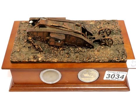 The Danbury Mint collectors edition George V penny, The First Tank, with commemorative medallion. Some small losses to the re