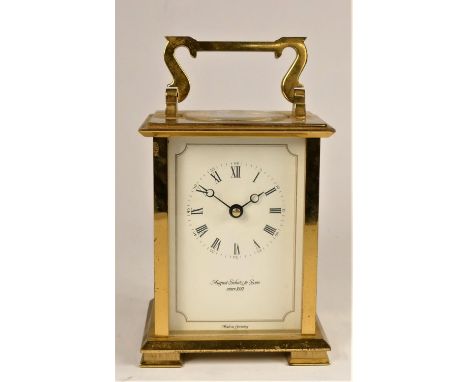 August Schatz &amp; Sons, a German brass 1/2 hour striking carriage clock, the white enamel dial with Roman numerals, the 7 j