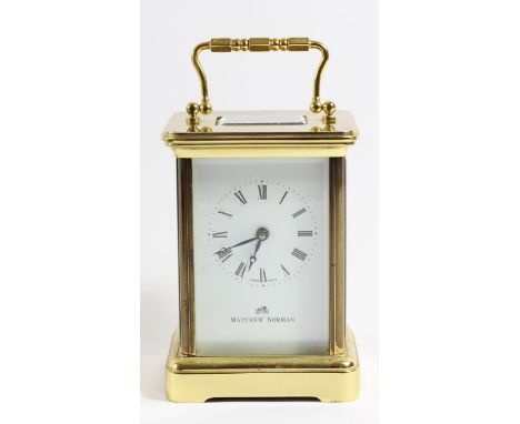 Matthew Norman, a brass carriage time piece, the white enamel dial with Roman numerals, the 11 jewel unadjusted Swiss movemen
