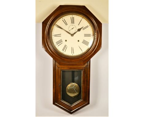 Ansonia Clock Co., an American mahogany drop dial wall clock, the 11 1/2" white enamel dial with Roman numerals and subsidiar