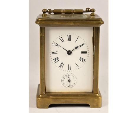 A brass alarm carriage time piece, the white enamel dial with Roman numerals, subsidiary alarm dial, the movement unsigned, s