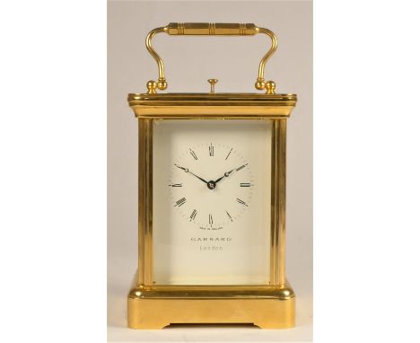 Garrard, London, a brass 1/2 hour striking and repeating carriage clock, the white enamel dial with Roman numerals, the 11 je