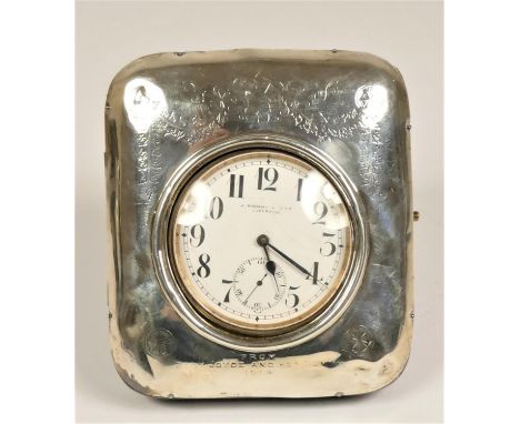 A silver mounted easel pocket watch holder, Birmingham Birmingham 1907, with 1913 presentation, opening to reveal a goliath p