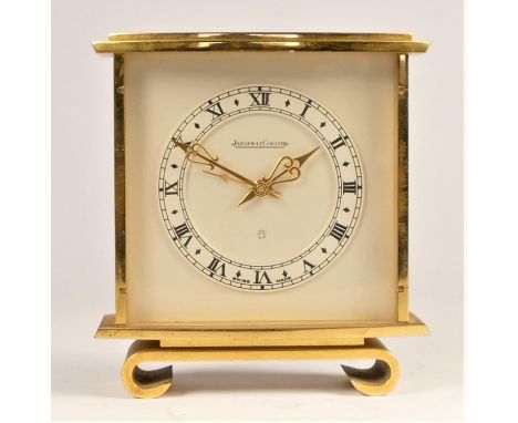 Jaeger LeCoultre, a brass 8 day alarm mantle clock, c.1960/70, the silvered dial with Roman numerals, raised on a plinth, num