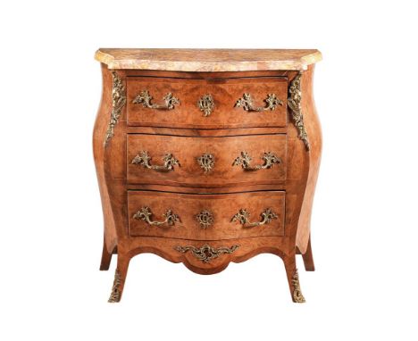 A FRENCH WALNUT AND GILT METAL MOUNTED COMMODE IN LOUIS XVI STYLE19TH CENTURYOf bombe outline, the marble top above the arran