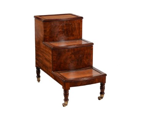 A REGENCY MAHOGANY LIBRARY STEP COMMODE CIRCA 1820With tooled leather insets to the treads, the top hinged, the central step 