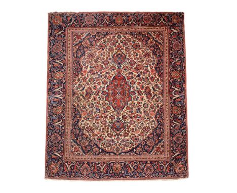 A KASHAN RUGApproximately 158 x 116cm Condition Report: Some wear overall. There is a neatly executed stitched join line acro