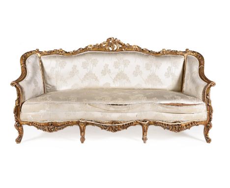 A FRENCH CARVED GILTWOOD SOFA IN LOUIS XVI STYLEEARLY 20TH CENTURYThe frame with profuse floral carvingProvenance: Elibank Ho