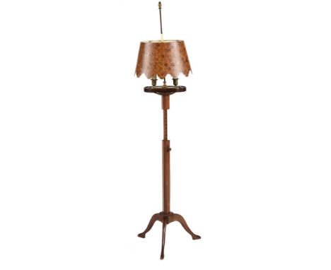 A MAHOGANY ADJUSTABLE STANDARD LAMP19TH CENTURYWith lamp bouillotte style fitment and tole shade, on a triskelion base153cm h