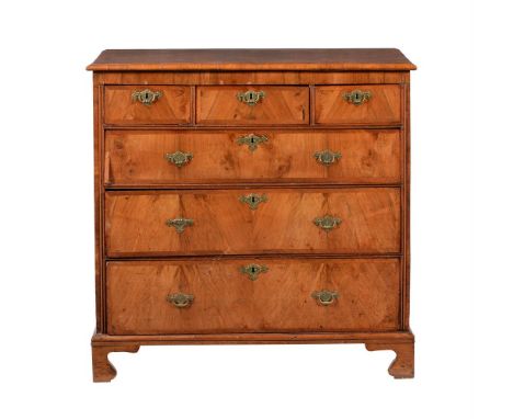 A WALNUT CHEST OF DRAWERS18TH CENTURY AND LATER With quarter veneered and crossbanded top over three short and three long gra
