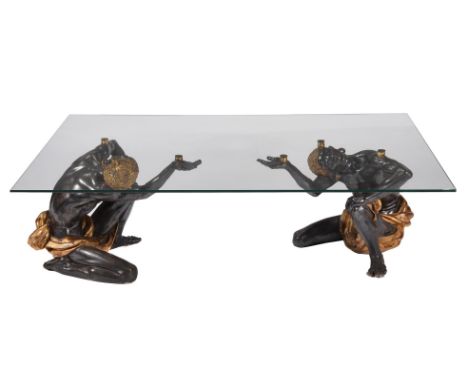 A PATINATED COMPOSITION LOW CENTRE TABLE 20TH CENTURY The glass top supported above the two crouching figures 50cm high, 151c