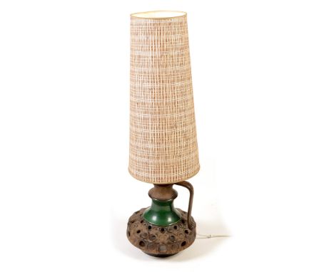 A modern ceramic lamp in the form of a ewer , with large oversized lampshade, 119.5cms high.