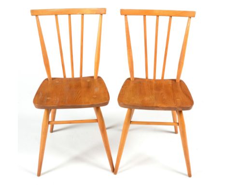 Ercol: two Windsor chairs, blonde, No 391, with tablet top-rails and spindle backs meeting the stretcher, raised on tapering 