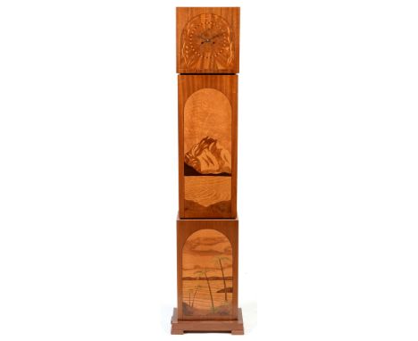 An unusual Art Deco walnut and exotic wood inlaid longcase clock, the dial decorated with leaf and flower design, two train m