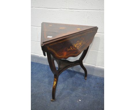 AN EDWARDIAN ROSEWOOD AND MARQUETRY INLAID TRIANGULAR OCCASIONAL TABLE, with drop leaves, over shaped legs united by an under