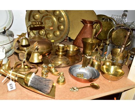 A GROUP OF BRASS, COPPER AND OTHER METAL WARES, to include a brass tray on a folding wooden stand, a large tray with poppy mo