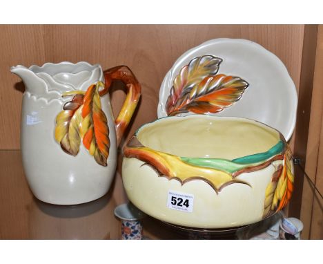 THREE PIECES OF CLARICE CLIFF POTTERY MOULDED IN THE AUTUMN LEAVES PATTERN, comprising a Newport Pottery fruit bowl, diameter