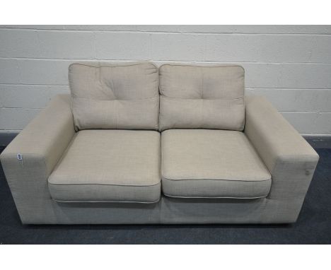 A BEIGE UPHOLSTERED TWO SEATER SOFA BED, length 178cm