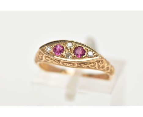 A 9CT GOLD RUBY AND DIAMOND BOAT RING, a navette shaped ring set with two circular cut ruby stones, accented with four round 
