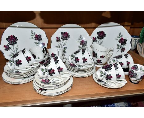 A ROYAL ALBERT MASQUERADE PATTERN TEA SET AND PART COFFEE SET, comprising three twin handled bread and butter plates, milk ju