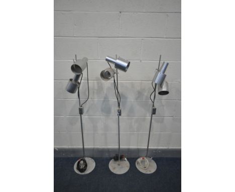 PETER NELSON FOR ARCHITECTURAL LIGHTING LTD, a set of three 1960's brushed aluminium floor lamps, with twin adjustable lights