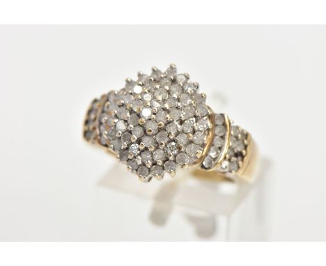 A DIAMOND CLUSTER RING,a yellow metal diamond cluster ring,  tapered shoulders to a plain polished band, stamped diamond weig