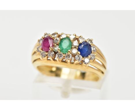 AN 18CT GOLD MUTLI GEM SET RING, designed with an oval cut ruby, emerald and blue sapphire, each within a round brilliant cut