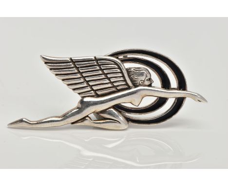 A WHITE METAL PENDANT,  depicting a female body with wings and two surrounding rings, black enamel on the rings, approximate 