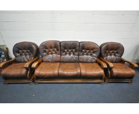 A BROWN LEATHER AND OAK FRAMED THREE PIECE SUITE, comprising a three seater sofa, and a pair of armchairs (3) (condition:-som