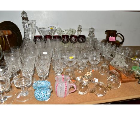 A GROUP OF CUT CRYSTAL AND OTHER GLASSWARES, to include a Nuutajärvi Finnish brown glass jug height 24cm, a small latticino p