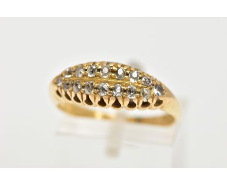 AN 18CT GOLD DIAMOND BOAT RING, a yellow gold ring set with sixteen old cut diamonds, leading onto a softened knife edge tape
