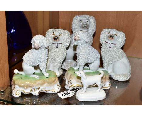 SIX 19TH AND 20TH CENTURY POODLE AND SPANIEL FIGURES, comprising a near pair of 20th century Dresden seated poodles on green 