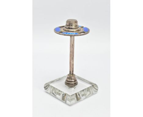 A 1930S SILVER ENAMEL MANICURE STAND,  a circular silver stand with blue guilloche enamel detail and four openings for items 