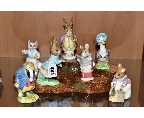 SEVEN BESWICK BEATRIX POTTER CHARACTERS AND A BESWICK TREE STUMP DISPLAY STAND, comprising 'Peter Rabbit' BP-3c, 'Tabitha Twi