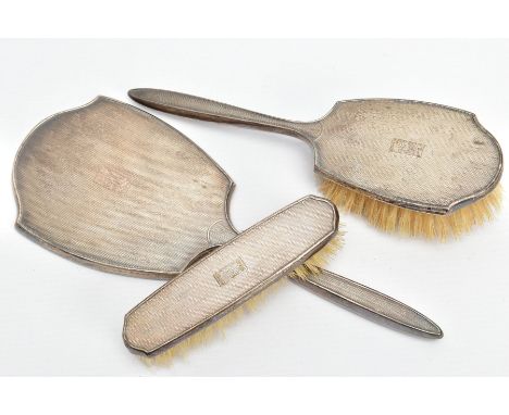 THREE SILVER VANITY PIECES, comprising of a mirror, hair brush and clothes brush, each with an engine turned design and engra