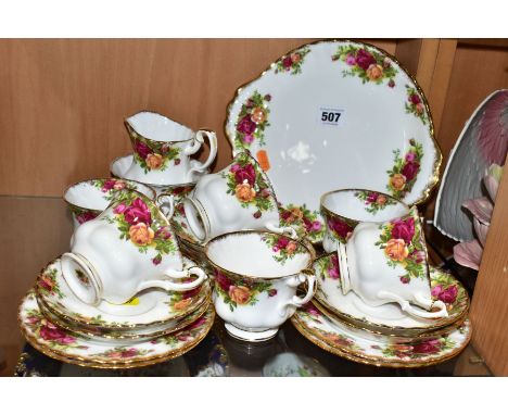 A ROYAL ALBERT OLD COUNTRY ROSES PATTERN TEA SET, comprising a twin handled bread and butter plate, milk jug, sugar bowl, six